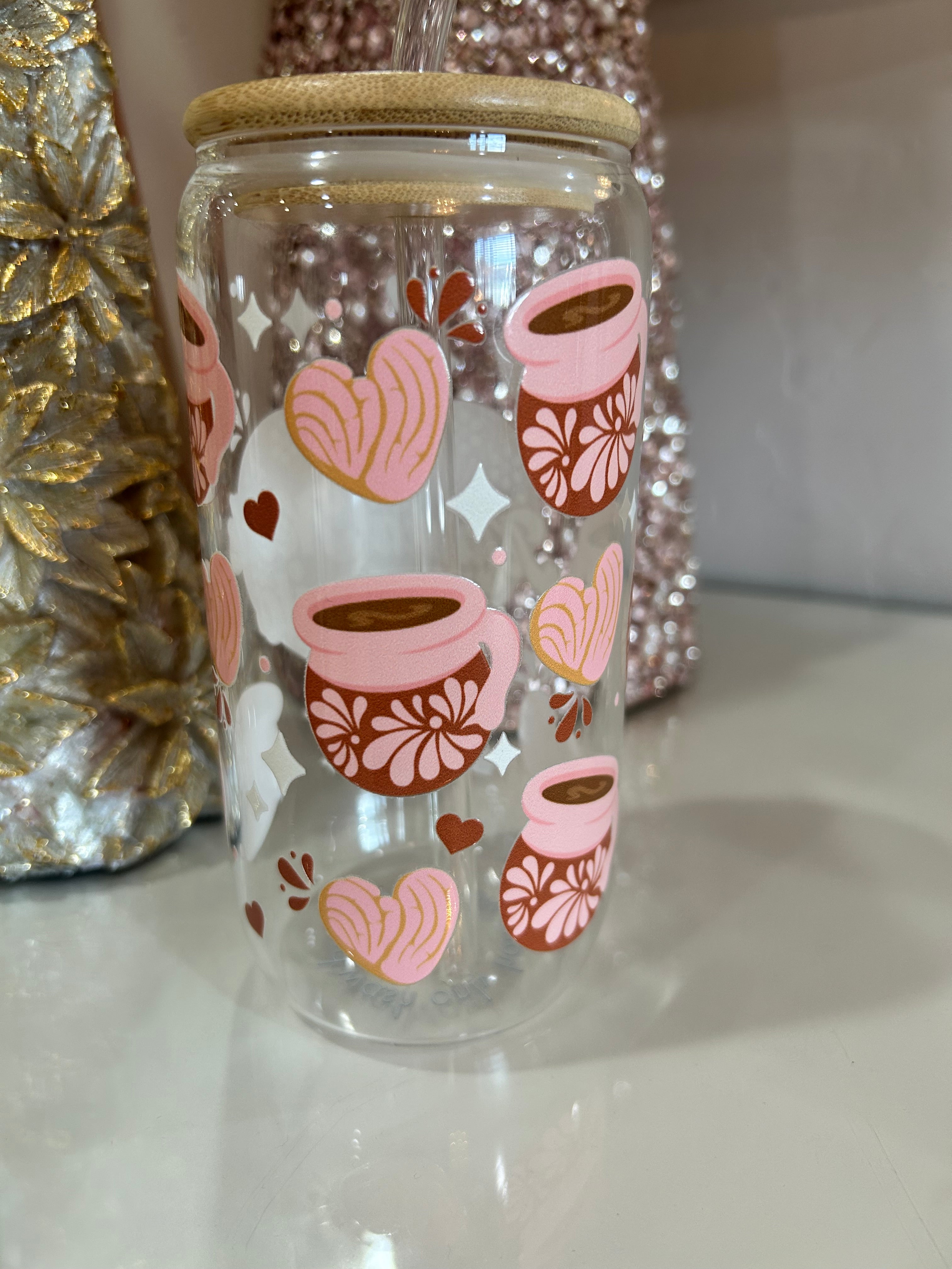 Clear glass tumbler cup with mama and cafecito design.
