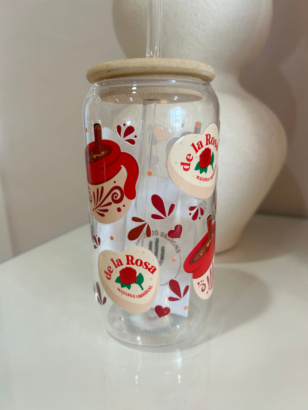 Clear glass tumbler cup with mazapan design, featuring de la Rosa mazapan original.