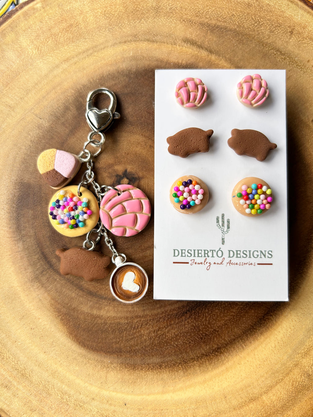 Pan Dulce Earring and Keychain Set with colorful charms on a wooden surface.